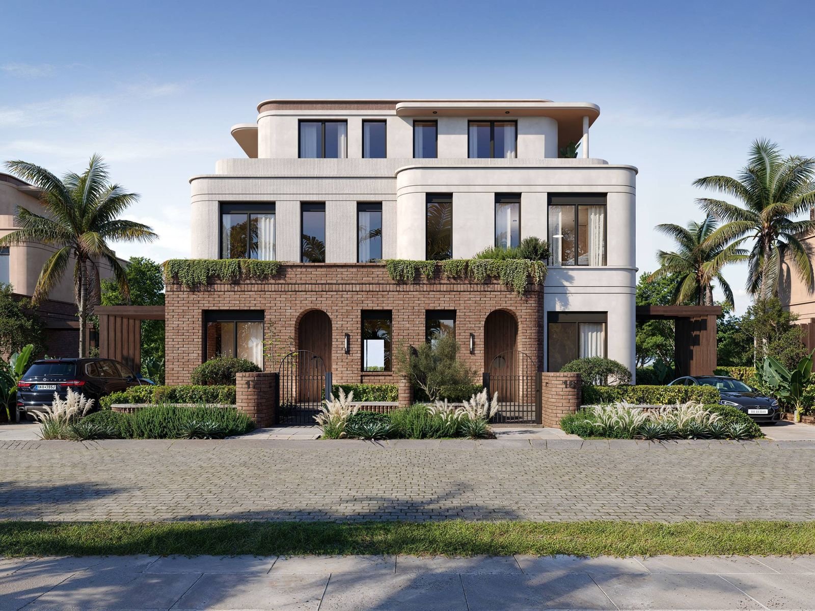 Building with two arched entrances, a brick facade and palm trees at Crescent Walk, 6th Settlement