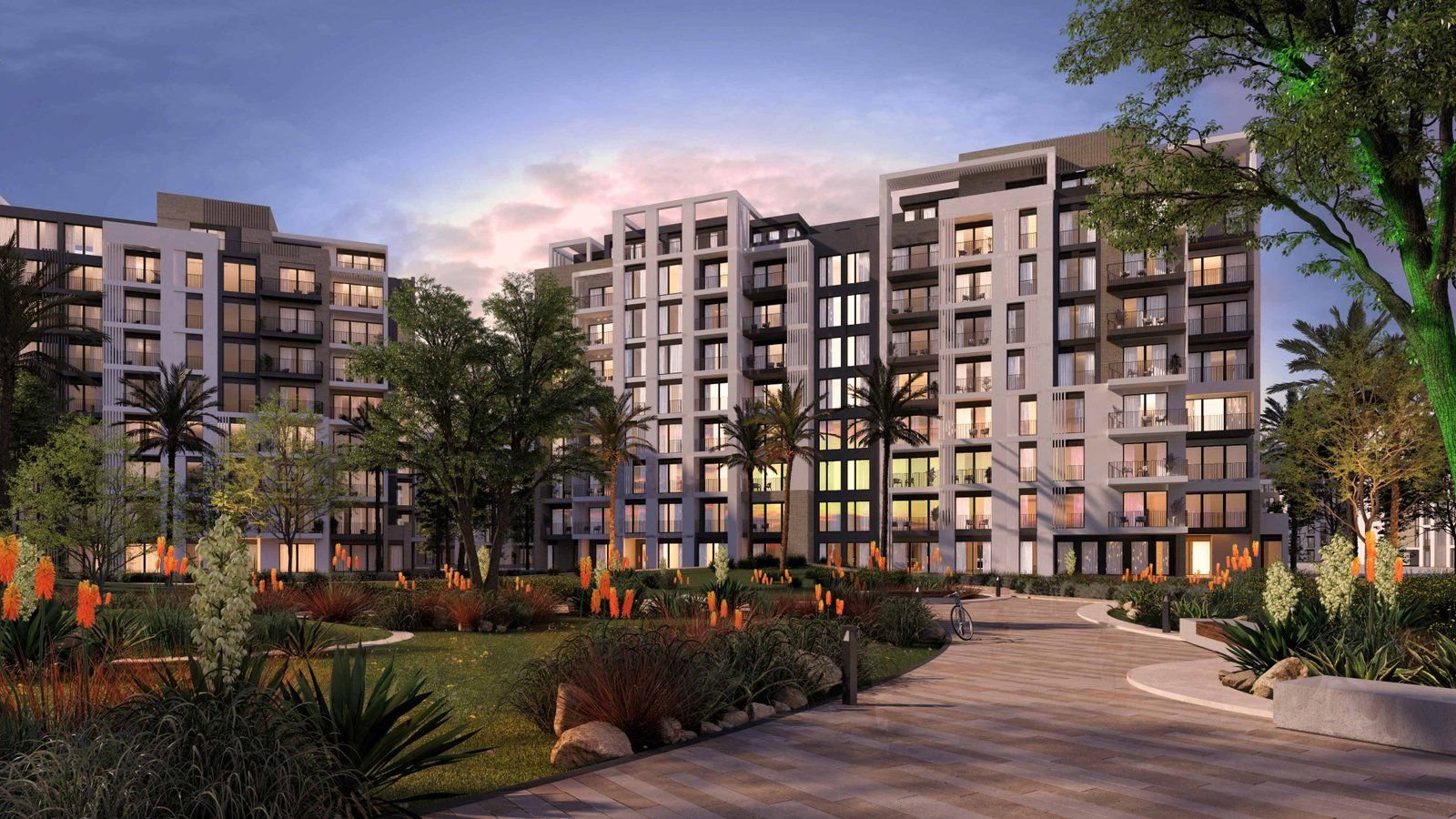 عمارات Zed East السكنية وممر مشجر عند الغروب في القاهرة الجديدة